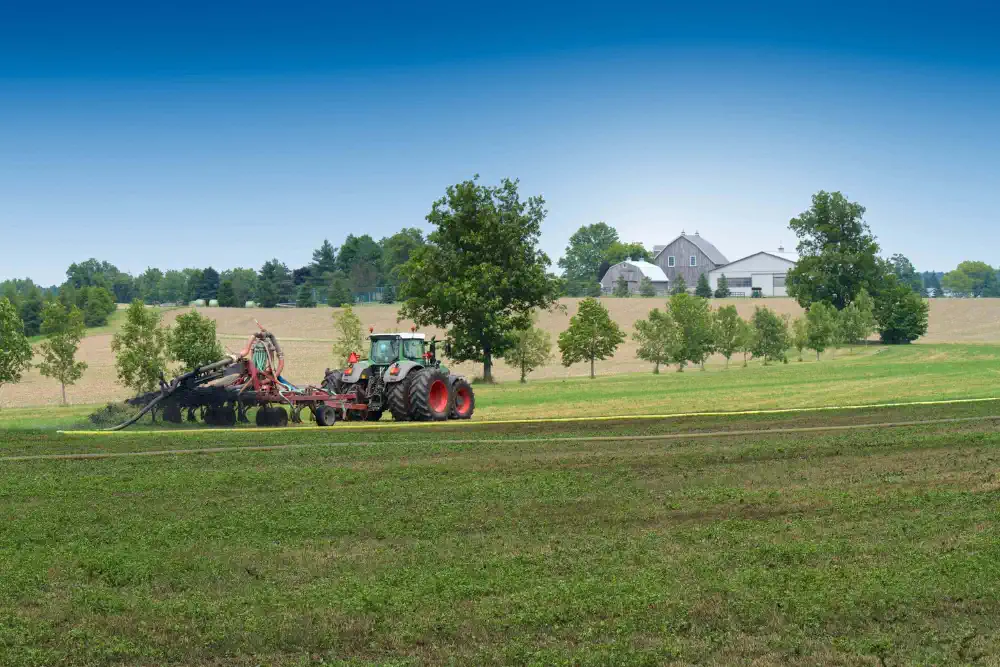 Tractor top spreading a hay field