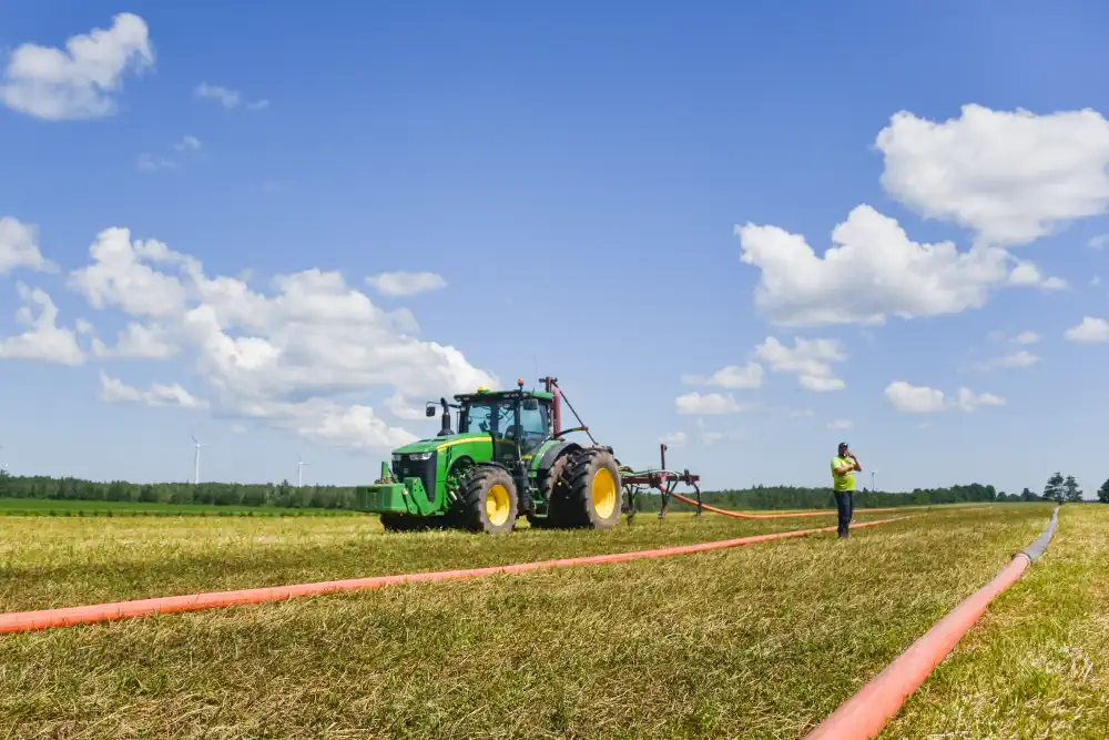 Tractor in field spreading organics